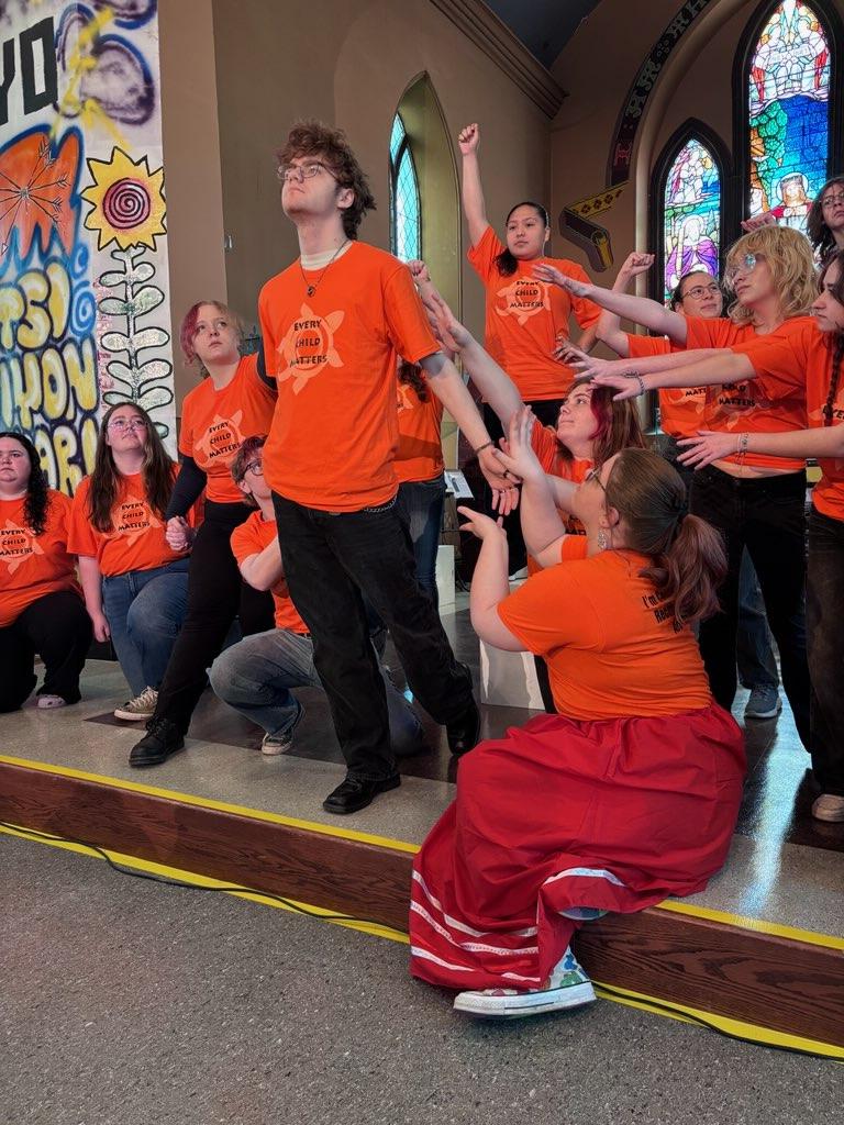 Students in a large group tableau